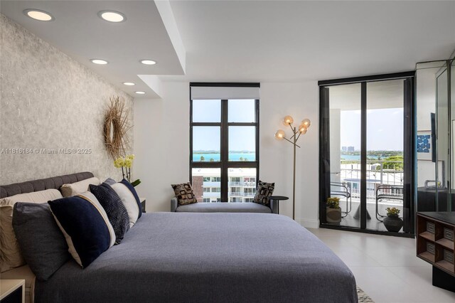 4000 Towerside Ter Unit 804, Miami, FL 33138 - bedroom with an accent wall, multiple windows, access to outside, expansive windows, and recessed lighting