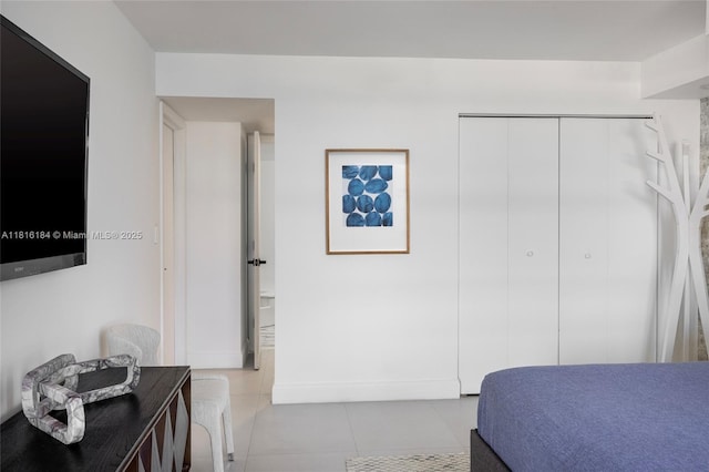4000 Towerside Ter Unit 804, Miami, FL 33138 - tiled bedroom featuring a closet and baseboards