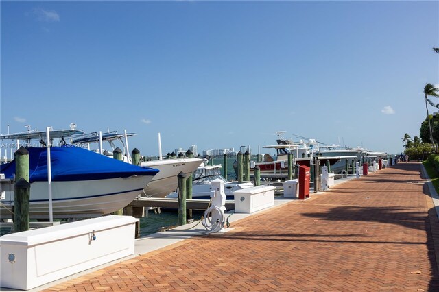4000 Towerside Ter Unit 804, Miami, FL 33138 - dock area featuring boat lift and a water view