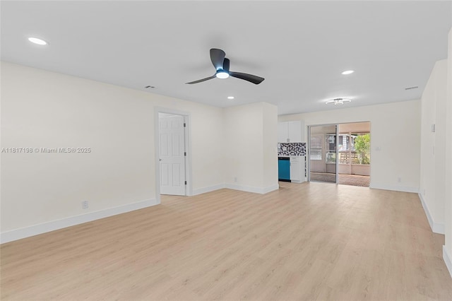 8510 SE Citrus Way, Hobe Sound, FL 33455 - unfurnished living room with baseboards, a ceiling fan, light wood finished floors, and recessed lighting