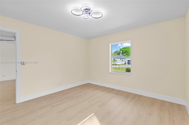 8510 SE Citrus Way, Hobe Sound, FL 33455 - empty room with wood finished floors and baseboards