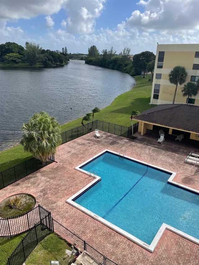 6575 W Oakland Park Blvd Unit 511, Lauderhill, FL 33313 - view of swimming pool with a water view and a patio