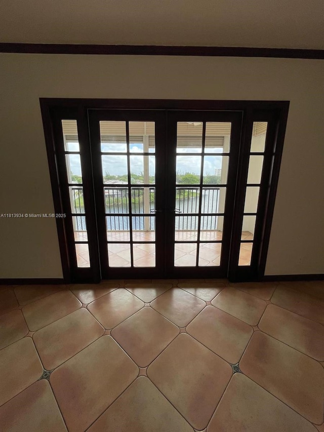 6575 W Oakland Park Blvd Unit 511, Lauderhill, FL 33313 - entryway featuring a water view and baseboards