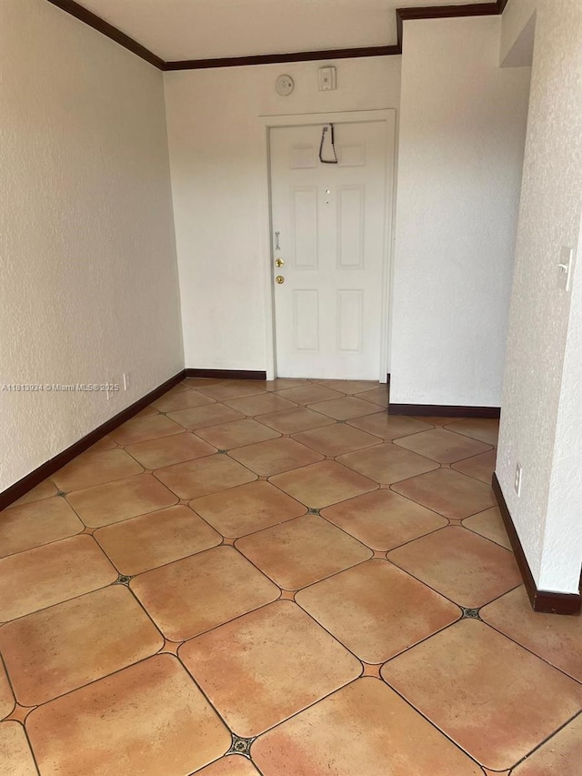 6575 W Oakland Park Blvd Unit 511, Lauderhill, FL 33313 - unfurnished room featuring ornamental molding, baseboards, light tile patterned flooring, and a smoke detector