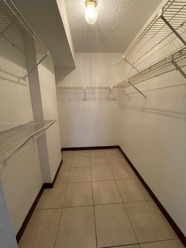 6575 W Oakland Park Blvd Unit 511, Lauderhill, FL 33313 - walk in closet featuring light tile patterned flooring