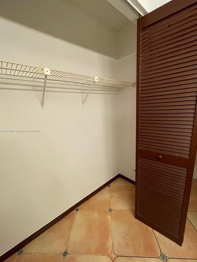 6575 W Oakland Park Blvd Unit 511, Lauderhill, FL 33313 - spacious closet featuring light tile patterned floors