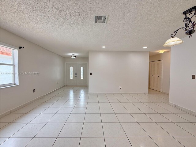 14945 SW 38th St, Miami, FL 33185 - spare room featuring recessed lighting, a textured ceiling, light tile patterned floors, and baseboards