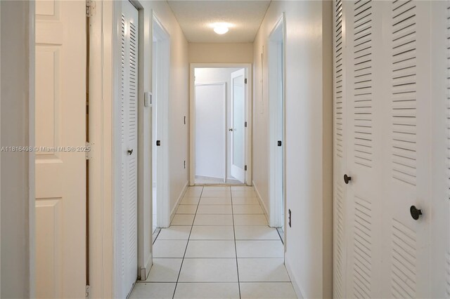 14945 SW 38th St, Miami, FL 33185 - hallway with light tile patterned floors and baseboards