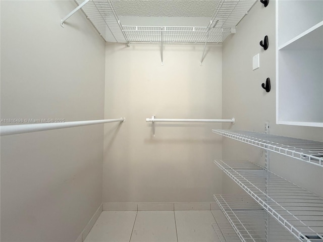 14945 SW 38th St, Miami, FL 33185 - spacious closet featuring tile patterned flooring