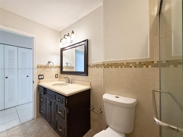 14945 SW 38th St, Miami, FL 33185 - full bath featuring vanity, tile walls, a closet, toilet, and a stall shower