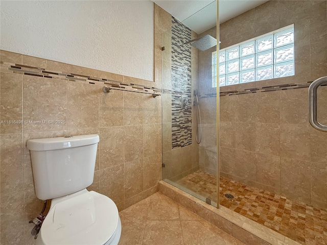 14945 SW 38th St, Miami, FL 33185 - bathroom featuring toilet, a stall shower, tile walls, and tile patterned floors