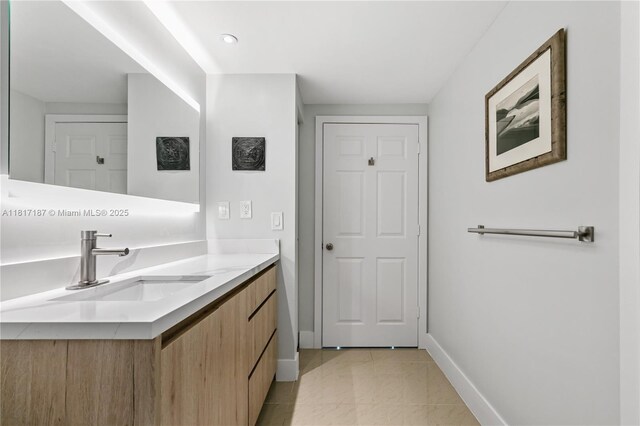 1900 Van Buren St Unit 407B, Hollywood, FL 33020 - bathroom with vanity, baseboards, and tile patterned flooring