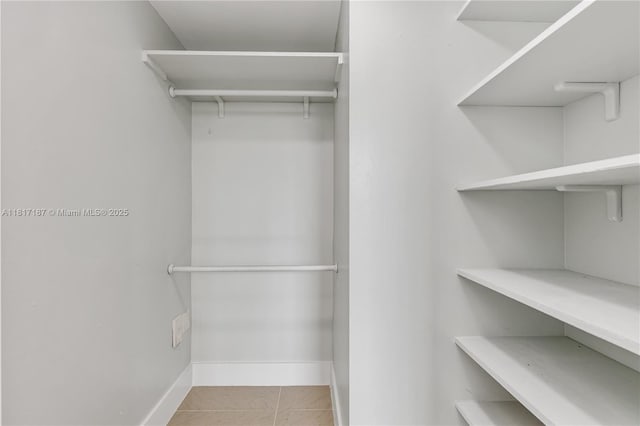 1900 Van Buren St Unit 407B, Hollywood, FL 33020 - spacious closet featuring tile patterned floors