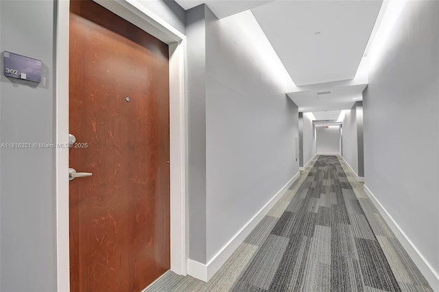 300 S Australian Ave Unit 302, West Palm Beach, FL 33401 - corridor with carpet flooring and baseboards