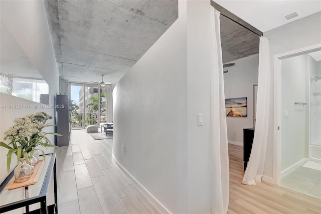 300 S Australian Ave Unit 302, West Palm Beach, FL 33401 - corridor featuring wood finished floors and baseboards