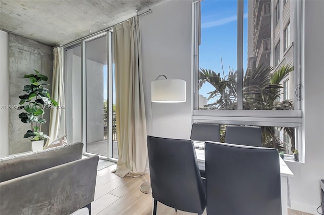 300 S Australian Ave Unit 302, West Palm Beach, FL 33401 - dining space featuring healthy amount of natural light and wood finished floors
