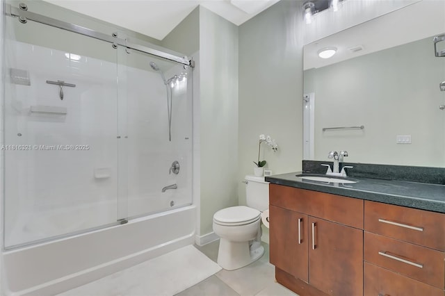 300 S Australian Ave Unit 302, West Palm Beach, FL 33401 - bathroom with vanity, toilet, shower / bath combination with glass door, and tile patterned floors