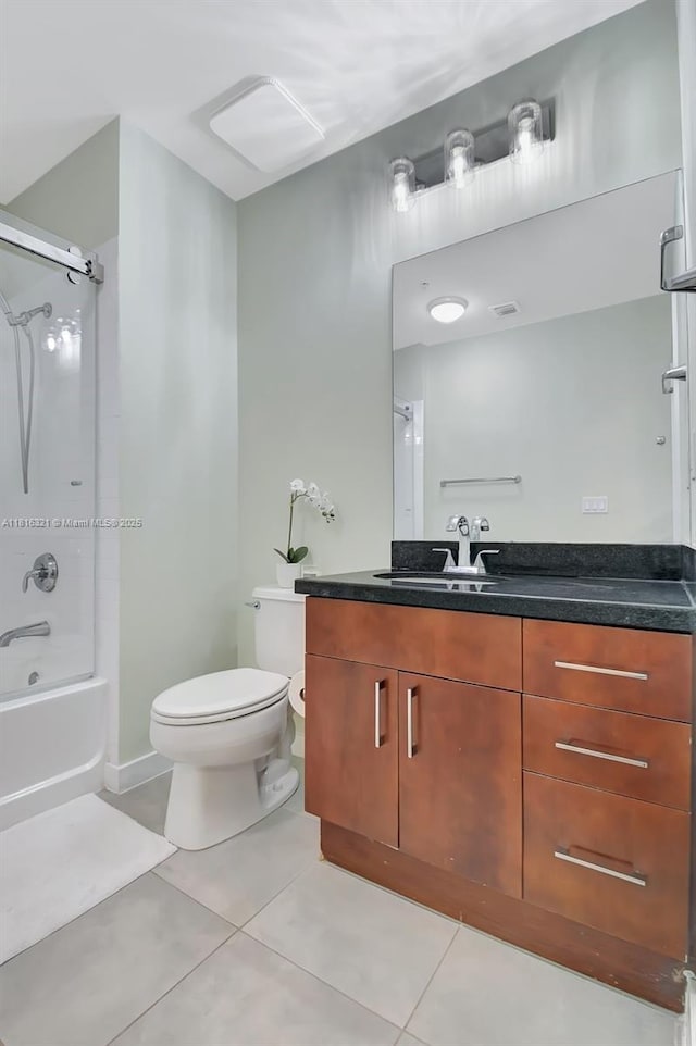300 S Australian Ave Unit 302, West Palm Beach, FL 33401 - bathroom featuring vanity, shower / washtub combination, tile patterned flooring, and toilet