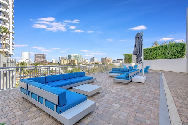 300 S Australian Ave Unit 302, West Palm Beach, FL 33401 - view of patio with an outdoor living space and a skyline view