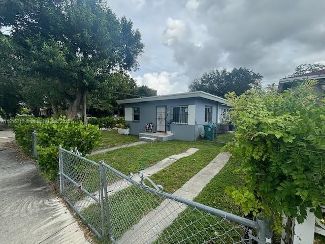 248 NW 69th St, Miami, FL 33150 - bungalow featuring stucco siding and a gate
