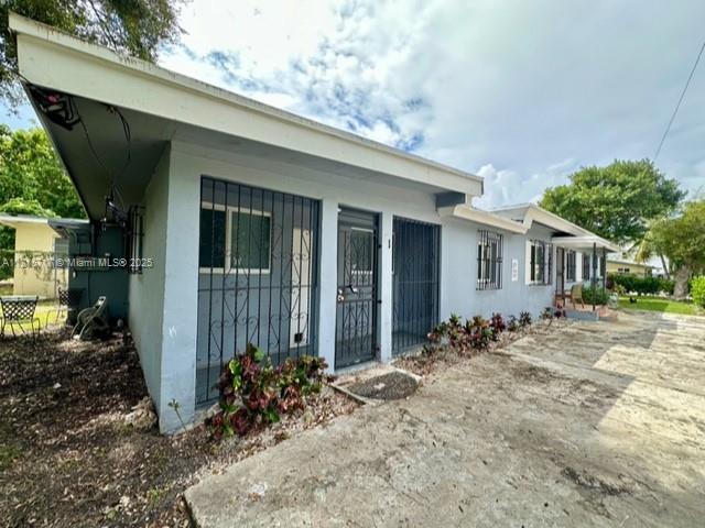 248 NW 69th St, Miami, FL 33150 - view of property exterior with stucco siding