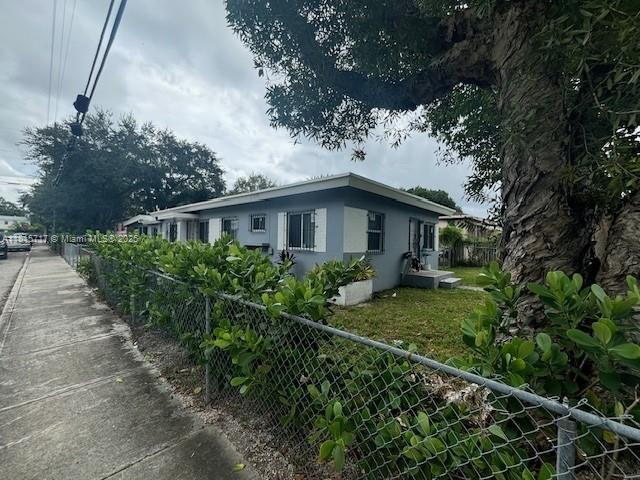 248 NW 69th St, Miami, FL 33150 - view of side of home featuring stucco siding