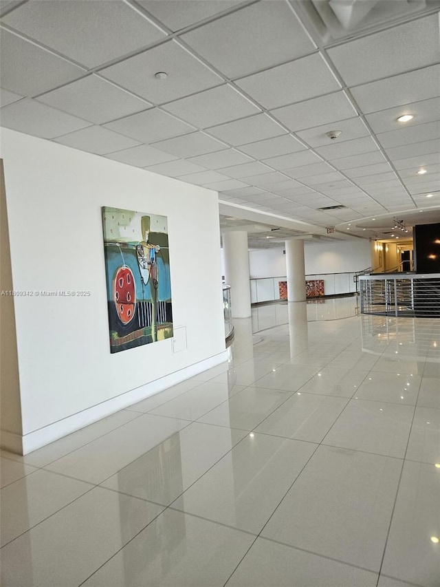 5701 E Collins Ave Unit Ph10, Miami Beach, FL 33140 - tiled spare room featuring a paneled ceiling