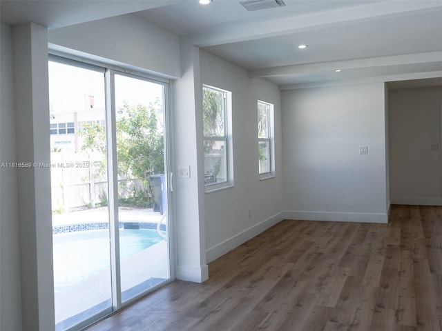 3613 SW 12th Pl, Fort Lauderdale, FL 33312 - unfurnished room with plenty of natural light, wood finished floors, baseboards, recessed lighting, and beam ceiling