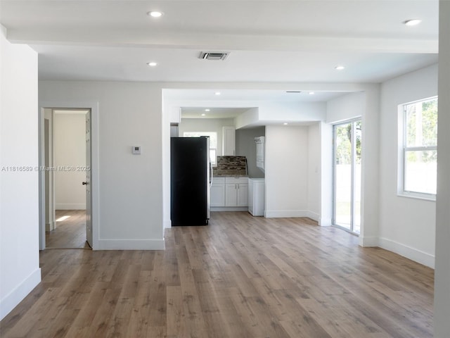 3613 SW 12th Pl, Fort Lauderdale, FL 33312 - unfurnished living room featuring baseboards, light wood-style floors, and recessed lighting