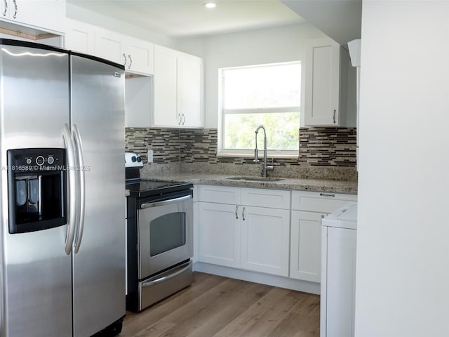 3613 SW 12th Pl, Fort Lauderdale, FL 33312 - kitchen featuring appliances with stainless steel finishes, a sink, white cabinetry, tasteful backsplash, and recessed lighting