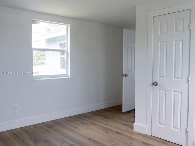3613 SW 12th Pl, Fort Lauderdale, FL 33312 - unfurnished bedroom featuring baseboards and light wood-style flooring