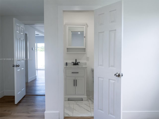 3613 SW 12th Pl, Fort Lauderdale, FL 33312 - hallway featuring baseboards and a sink