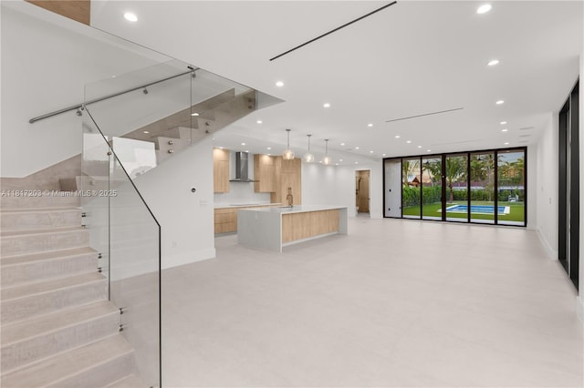 8811 SW 56th St, Miami, FL 33165 - unfurnished living room featuring recessed lighting, expansive windows, a sink, stairs, and baseboards