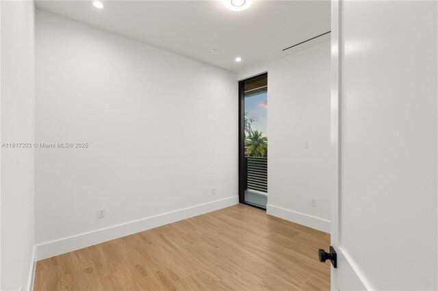 8811 SW 56th St, Miami, FL 33165 - empty room with light wood-style flooring, recessed lighting, and baseboards