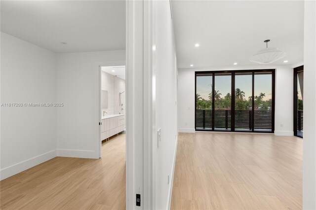 8811 SW 56th St, Miami, FL 33165 - unfurnished room with baseboards, light wood-style flooring, and recessed lighting