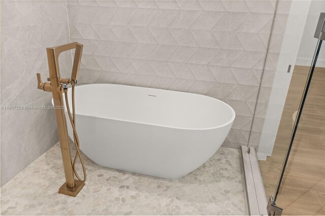 8811 SW 56th St, Miami, FL 33165 - bathroom with a stall shower, a freestanding bath, plenty of natural light, tile walls, and recessed lighting