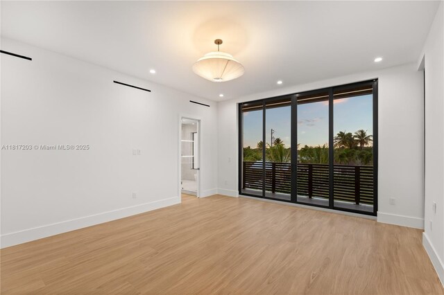 8811 SW 56th St, Miami, FL 33165 - spare room with baseboards, light wood-type flooring, and recessed lighting
