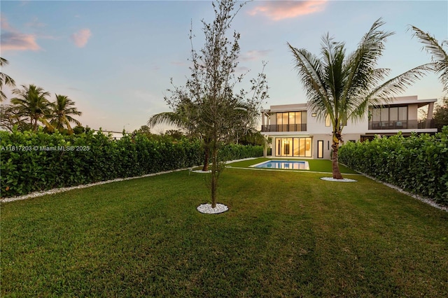 8811 SW 56th St, Miami, FL 33165 - yard at dusk with an outdoor pool and a yard