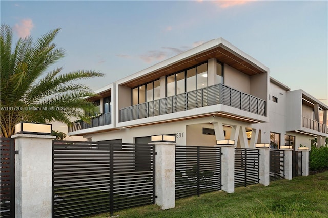 8811 SW 56th St, Miami, FL 33165 - view of front facade featuring a balcony and stucco siding