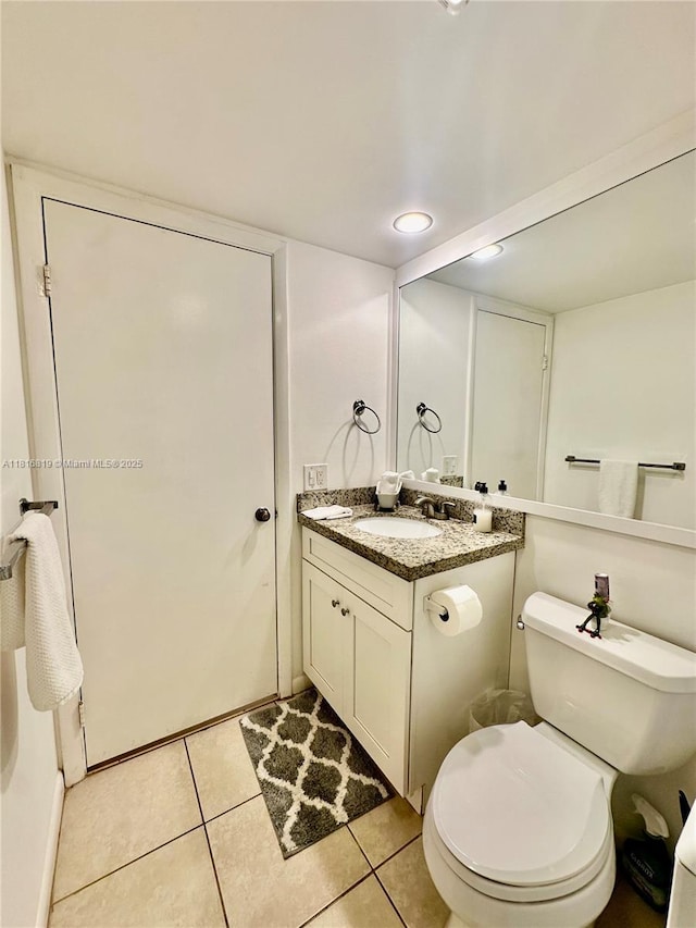 4306 43rd Way, West Palm Beach, FL 33407 - bathroom featuring vanity, tile patterned flooring, toilet, and recessed lighting