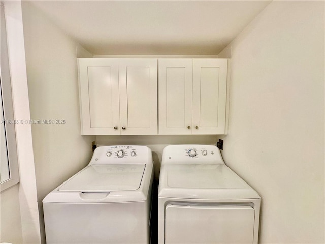 4306 43rd Way, West Palm Beach, FL 33407 - laundry room featuring cabinet space and washer and clothes dryer