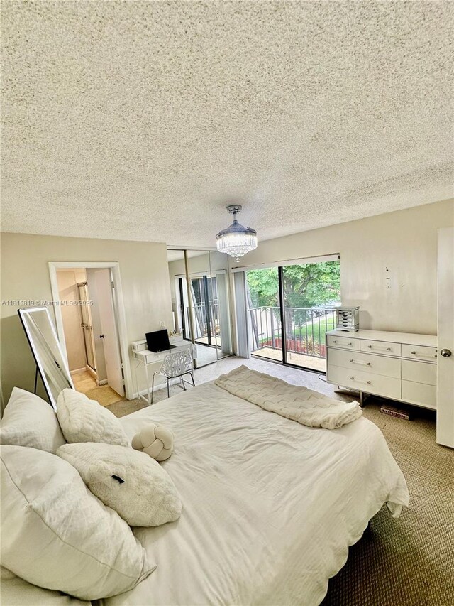 4306 43rd Way, West Palm Beach, FL 33407 - bedroom with access to exterior, a textured ceiling, and light colored carpet