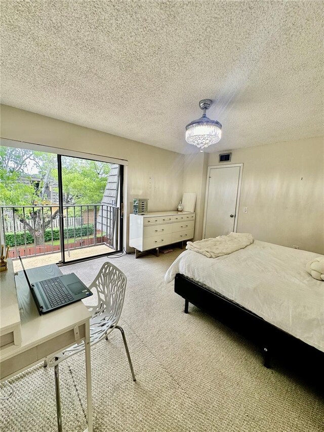 4306 43rd Way, West Palm Beach, FL 33407 - carpeted bedroom with access to exterior and a textured ceiling