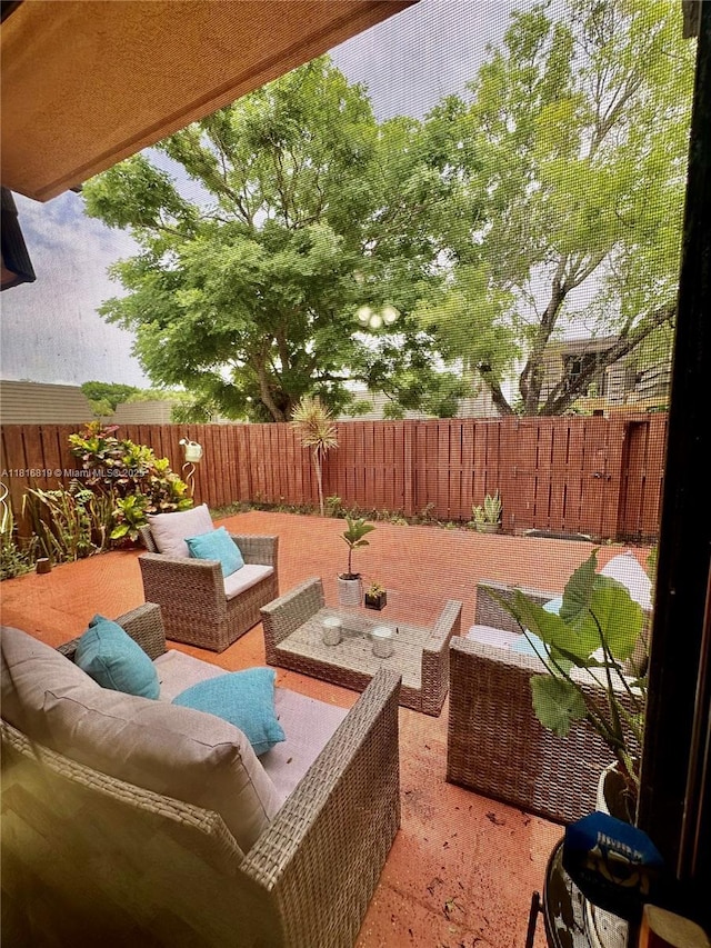 4306 43rd Way, West Palm Beach, FL 33407 - fenced backyard with an outdoor hangout area and a patio area