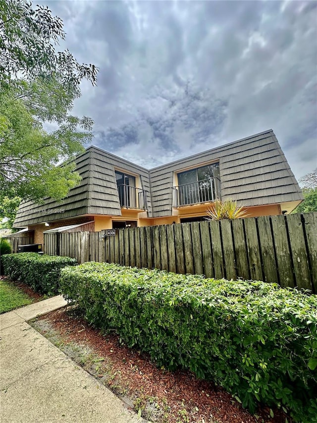 4306 43rd Way, West Palm Beach, FL 33407 - rear view of property featuring mansard roof