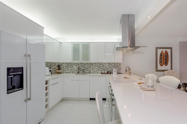 18151 NE 31st Ct Unit 1905, Aventura, FL 33160 - kitchen featuring white fridge with ice dispenser, island range hood, a sink, tasteful backsplash, and modern cabinets