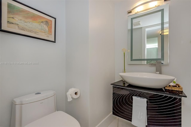 18151 NE 31st Ct Unit 1905, Aventura, FL 33160 - bathroom featuring toilet, vanity, and baseboards