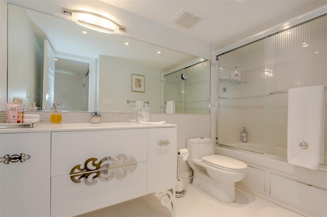 18151 NE 31st Ct Unit 1905, Aventura, FL 33160 - bathroom featuring vanity, toilet, combined bath / shower with glass door, tasteful backsplash, and recessed lighting