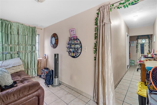 1478 SW 2nd St, Miami, FL 33135 - living area featuring light tile patterned floors and baseboards