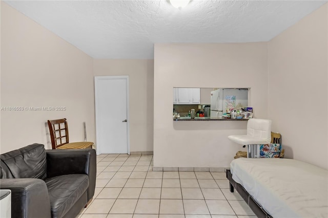 1478 SW 2nd St, Miami, FL 33135 - bedroom with light tile patterned flooring and a textured ceiling